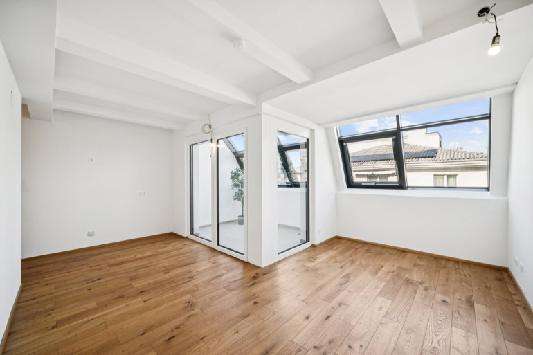 Wohnung - 1100, Wien - Erstbezug im Dachgeschoss: Stilvolle 2-Zimmer-Maisonette mit Wintergarten und Kamin-Option nahe Hauptbahnhof