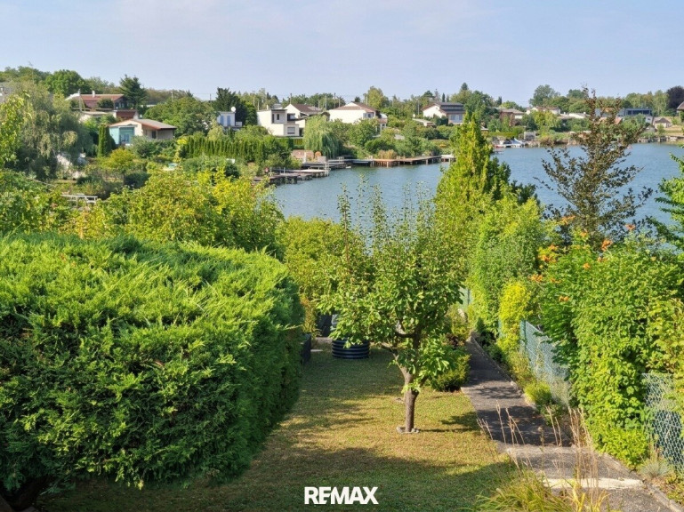 Haus - 2491, Zillingdorf-Bergwerk - Uferparzelle am Steinbrunner See mit entzückendem Ferienhaus
